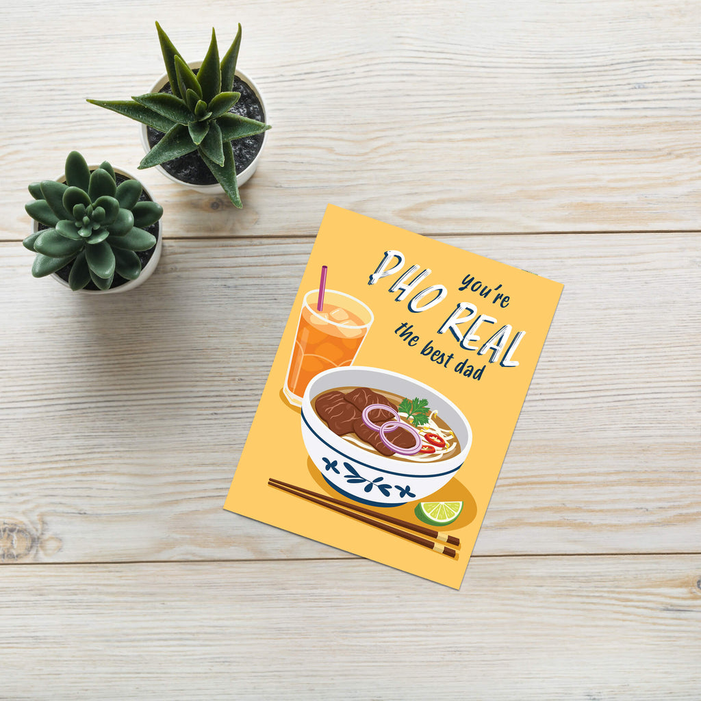 unique fathers day card with a bowl of pho, glass of iced tea, and text 'you're PHO REAL the best dad' on a yellow background.
