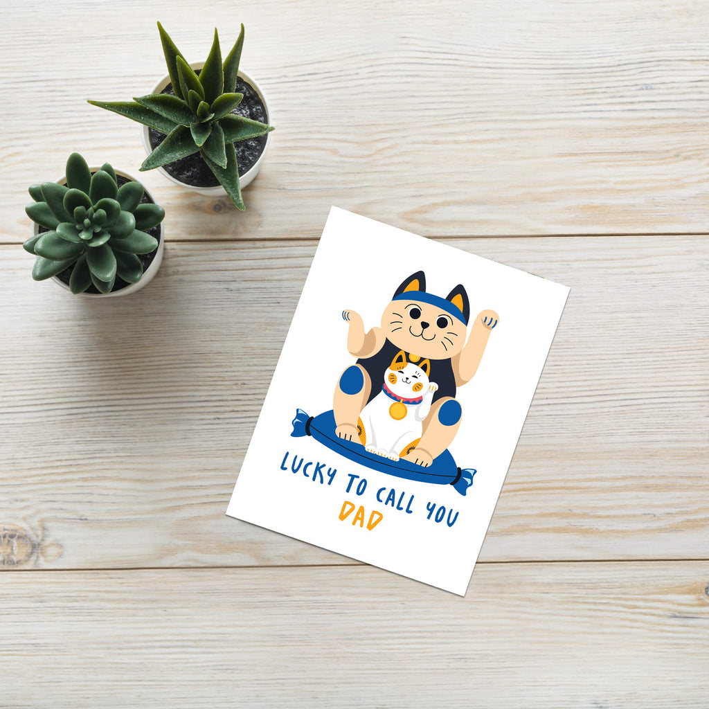 cute father's day card with japanese maneki neko lucky cat design and text 'Lucky to call you Dad' on a white background.