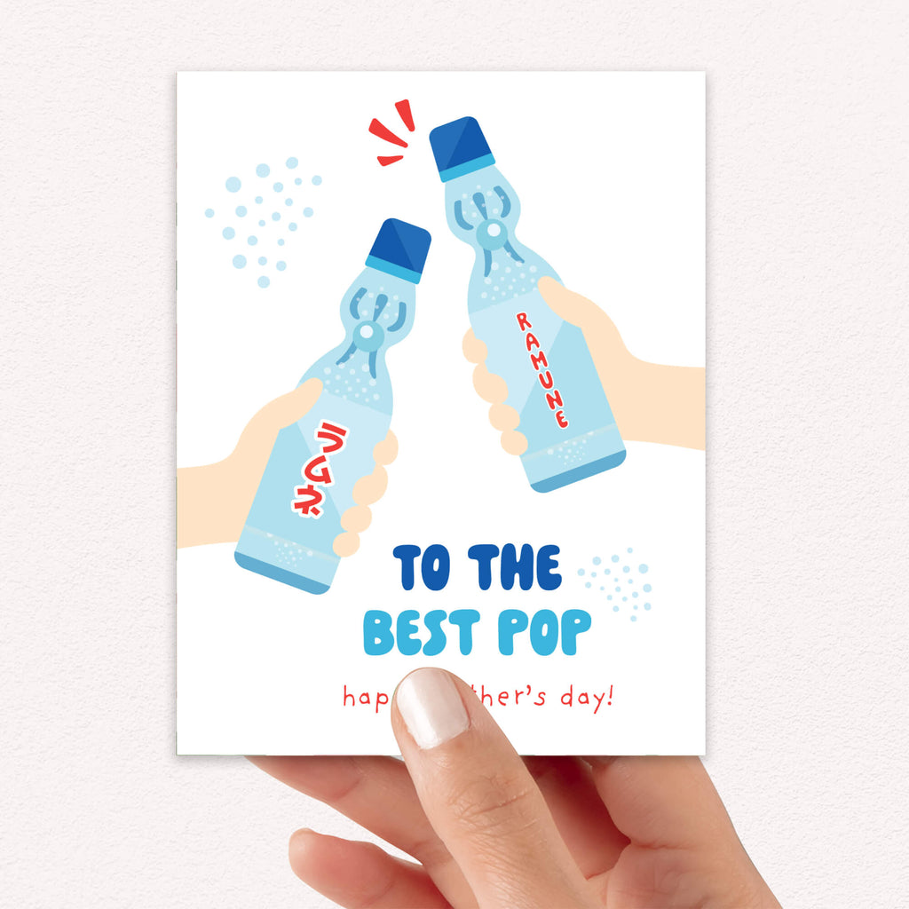 funny Father's Day card with two hands holding japanese soda pop ramune bottles and pun 'To the best pop happy father's day!'.