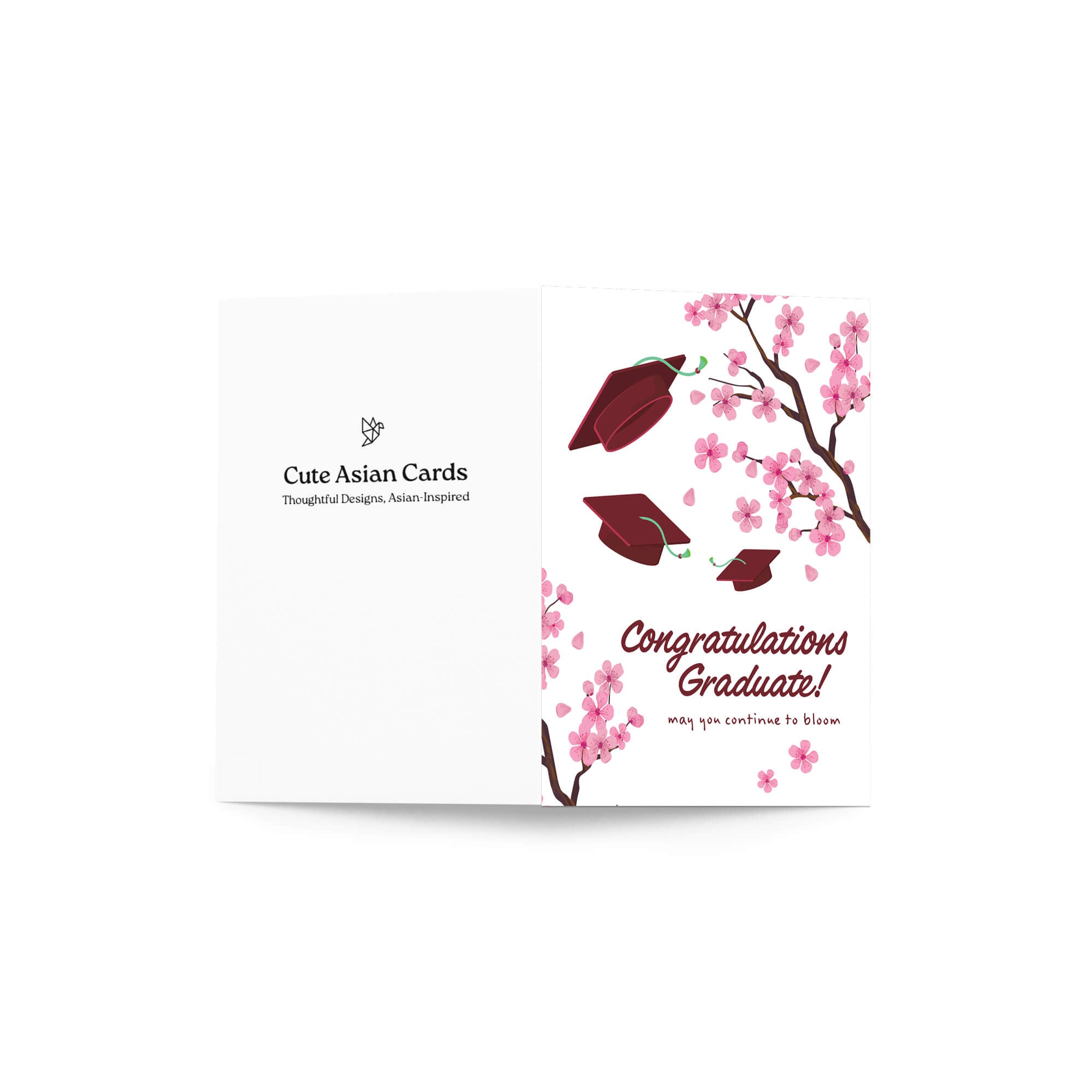 Graduation card with japanese cherry blossoms and red graduation caps on a white background