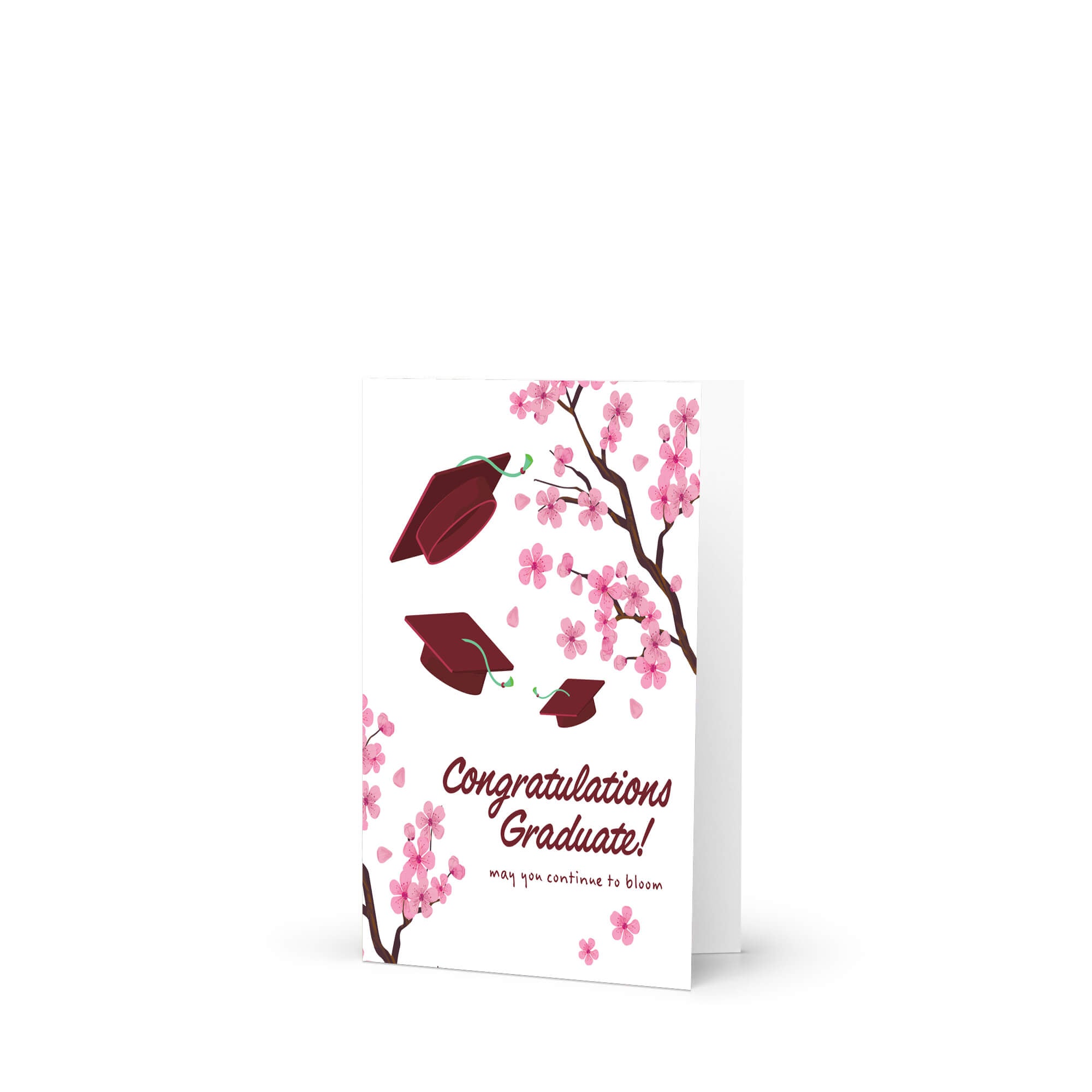 Graduation card with japanese cherry blossoms and red graduation caps on a white background