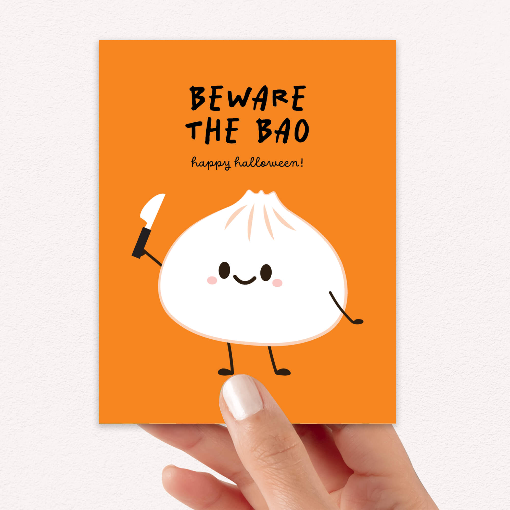 Halloween card with a cartoon bao bun and text on an orange background