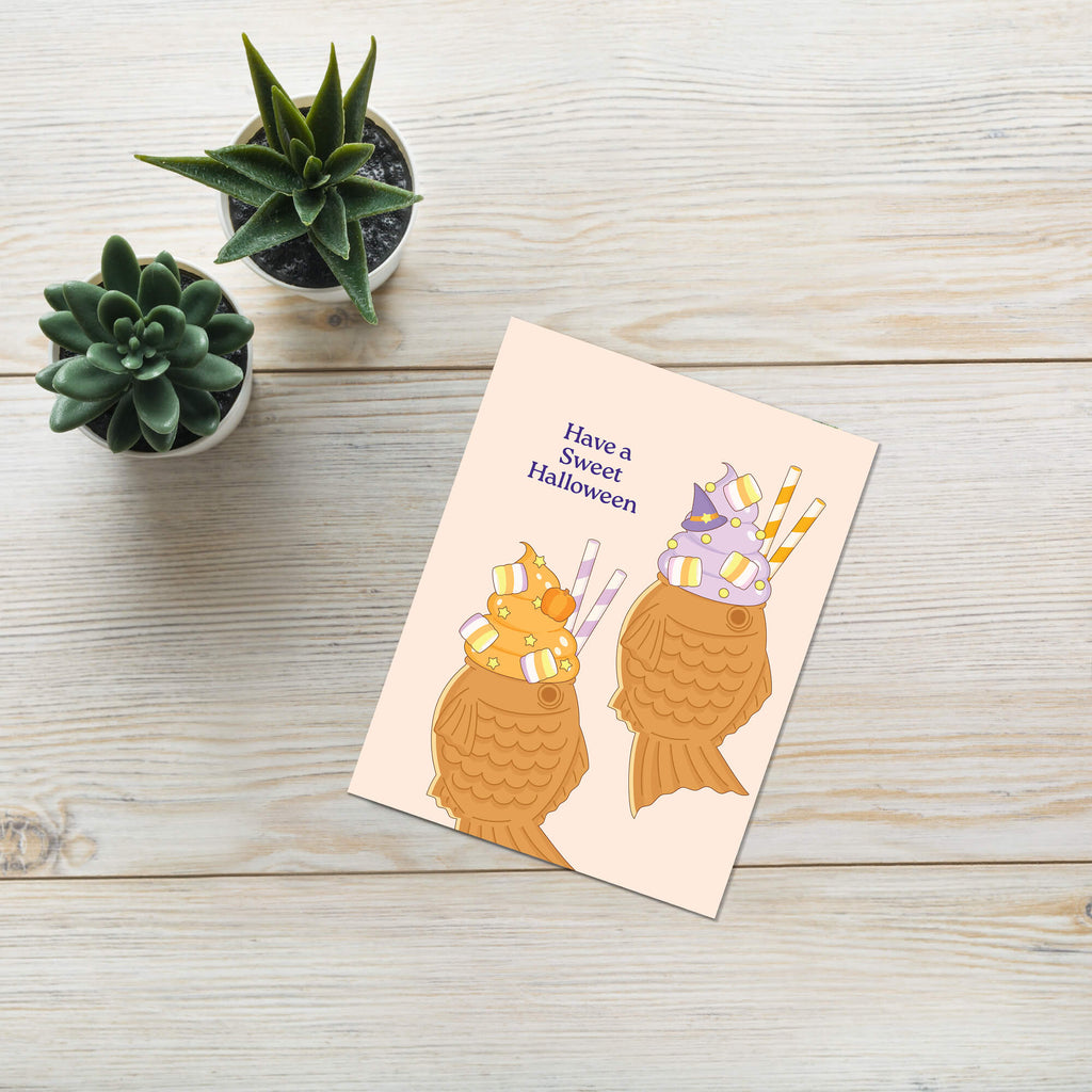 kawaii japanese Halloween-themed greeting card with ice cream taiyaki cones and text on a beige background, 