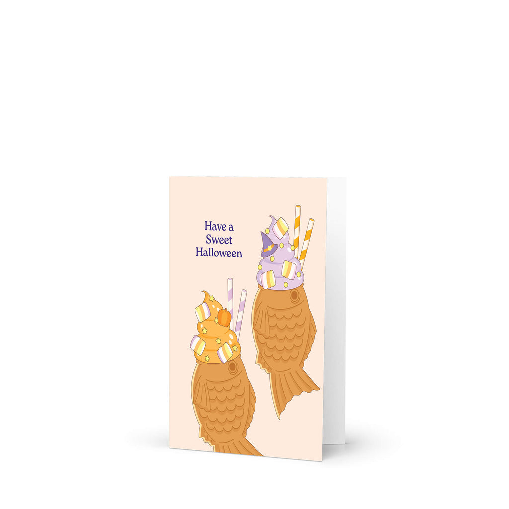 kawaii japanese Halloween-themed greeting card with ice cream taiyaki cones and text on a beige background, 