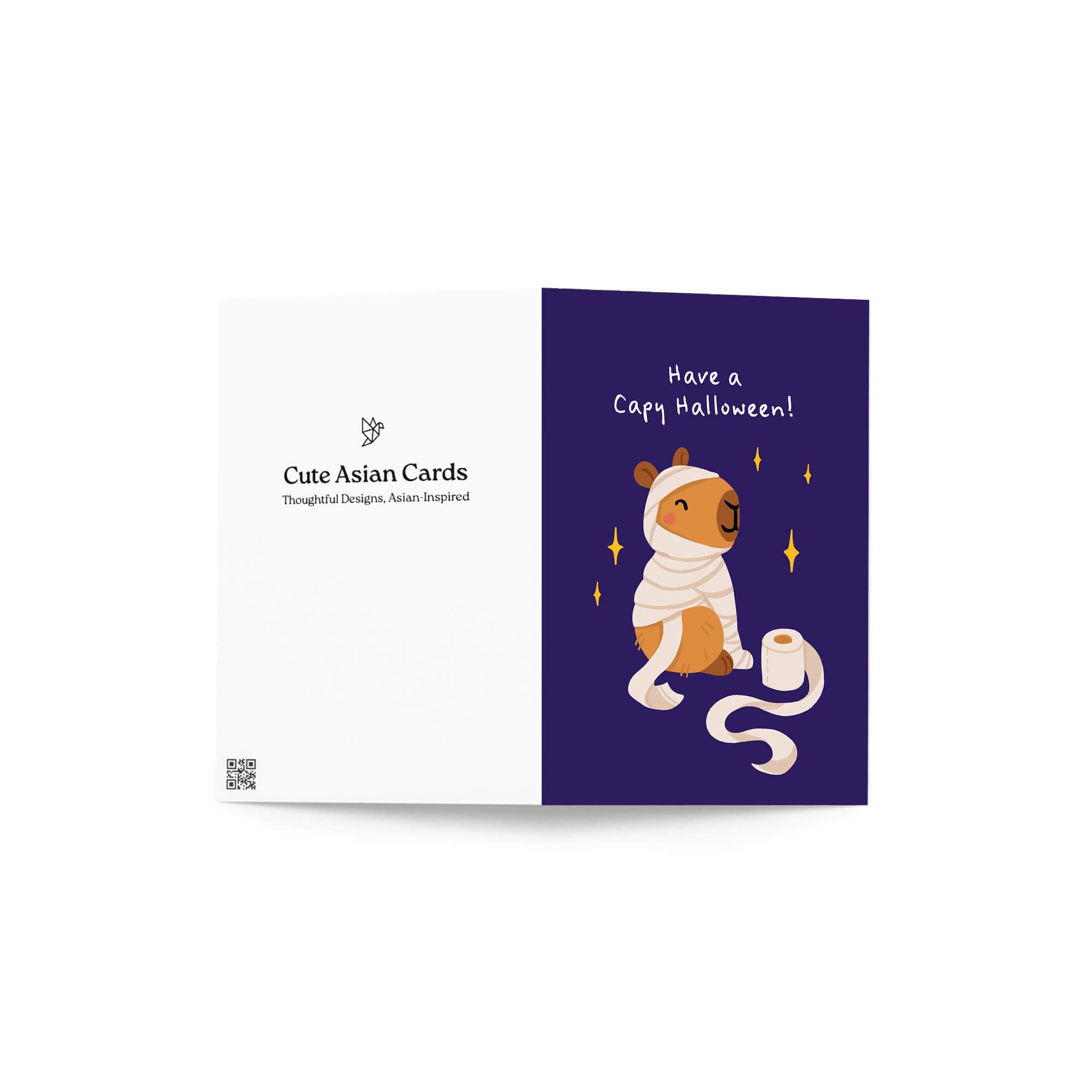 Halloween card with a cartoon capybara wearing a cape on a purple background.