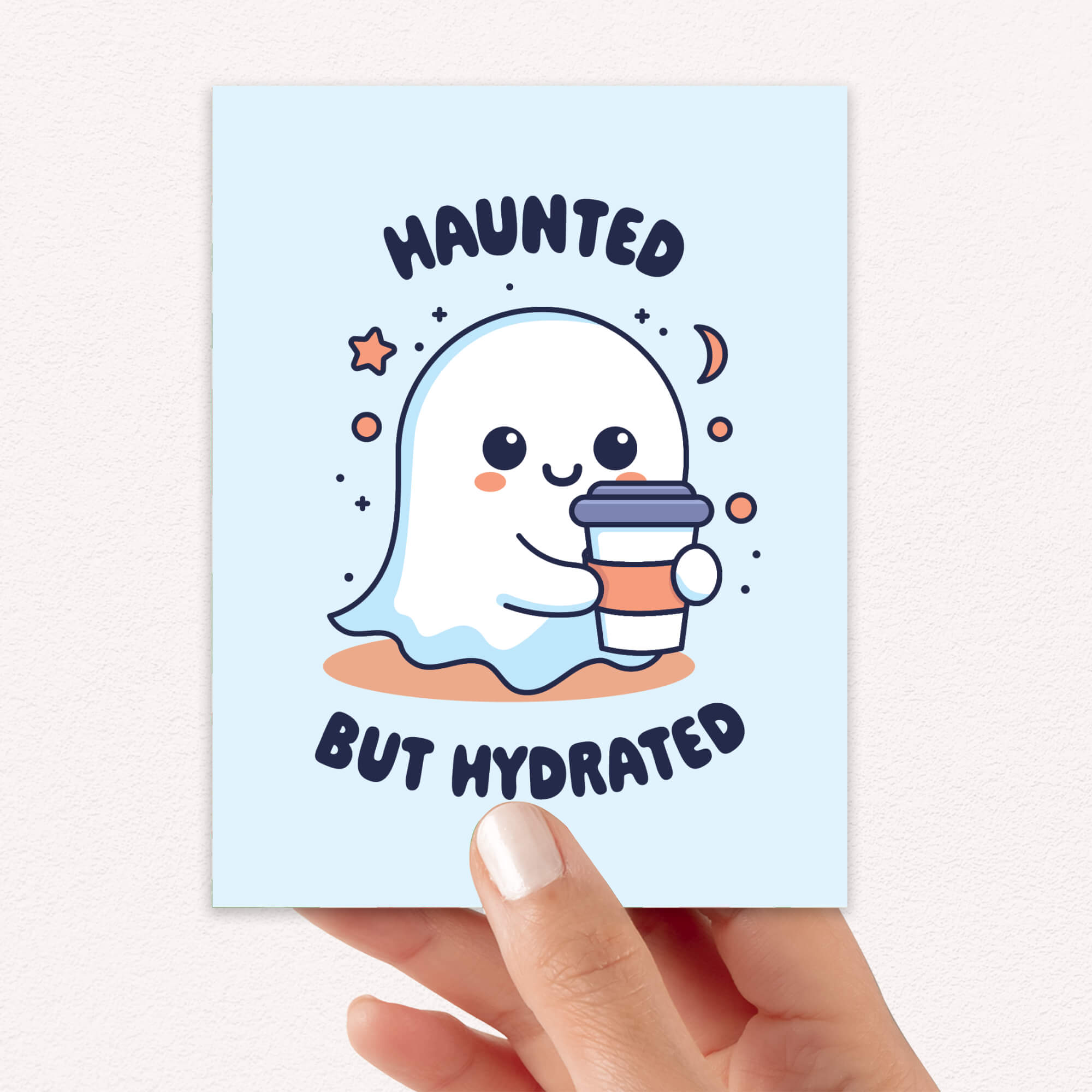 kawaii halloween Greeting card with a ghost holding a cup and 'Haunted But Hydrated' text on a light blue background.