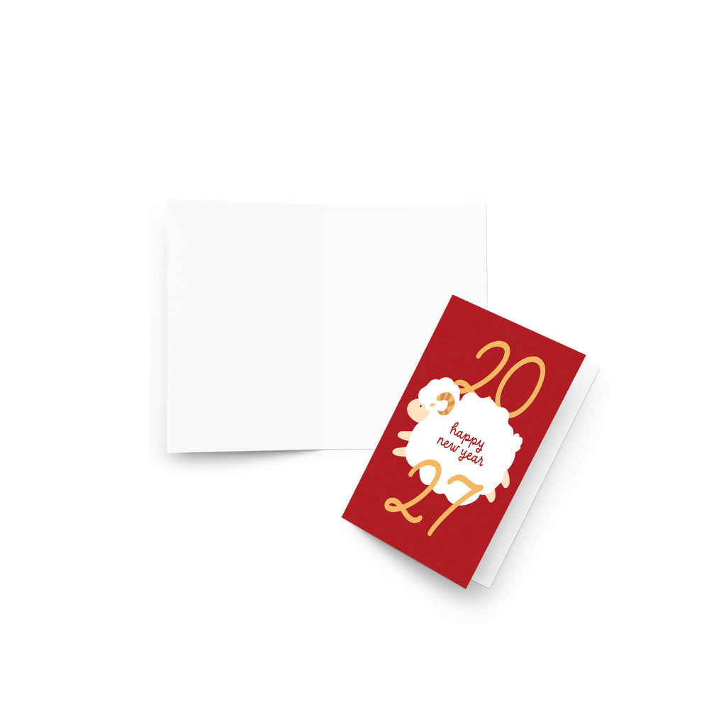 A red lunar new year card with gold '2027' numbers and a white sheep graphic reading 'happy new year' in red text, shown next to an open white card on a light gray background.
