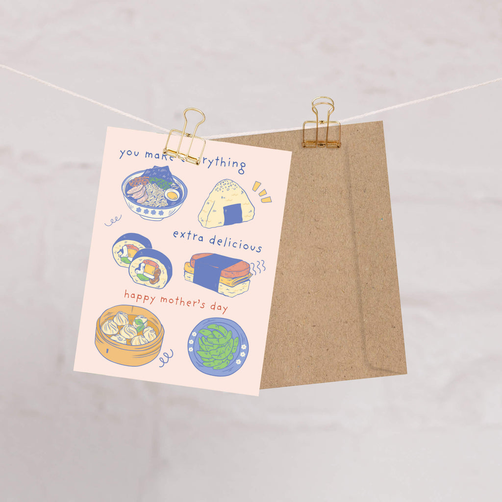 asian Greeting card with illustrations of asian food (ramen onirigi kimbap spam musubi edamame and dumplings) and a message: you make everything extra delicious for happy Mother's Day card on a pink background.