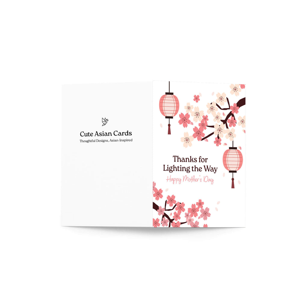 asian greeting card for mother's day with pink cherry blossom flowers and lanterns on a white background and text: thanks for lighting the way