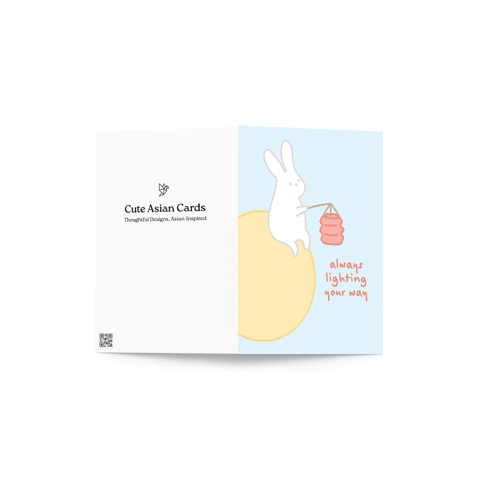 asian inspired Greeting card with a rabbit holding a lantern and text 'always lighting your way' on a light blue background. for mid autumn festival