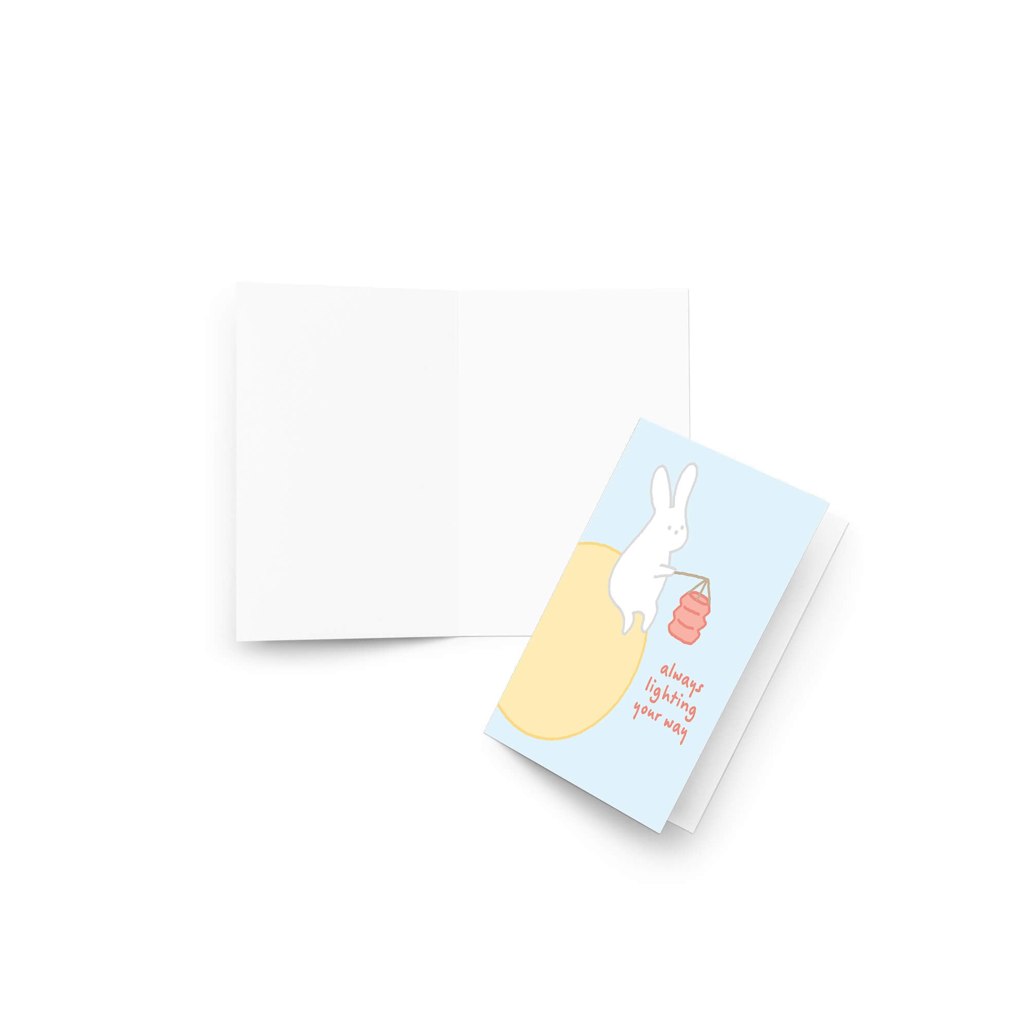 asian inspired Greeting card with a rabbit holding a lantern and text 'always lighting your way' on a light blue background. for mid autumn festival