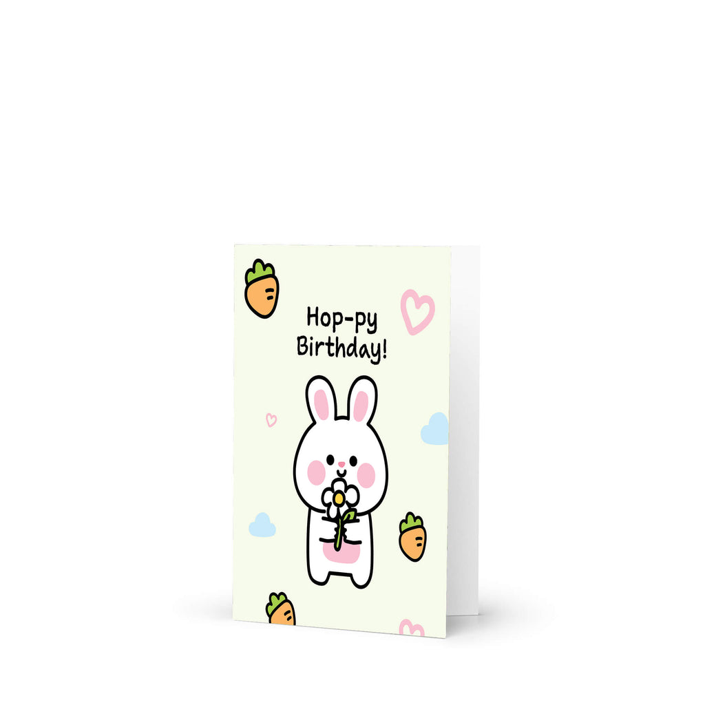 Greeting card with a cartoon rabbit and 'Happy Birthday!' text on a white background