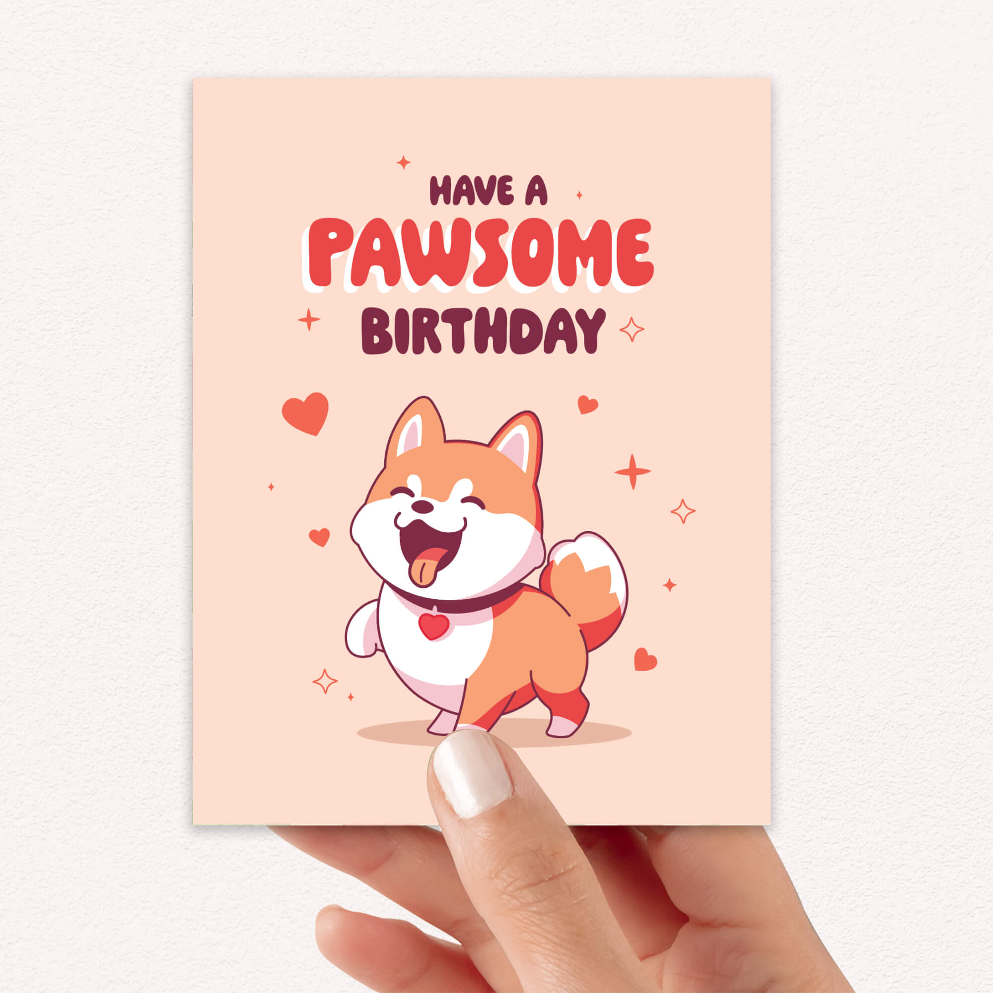 Birthday card with a cartoon dog and 'Have a Pawsome Birthday' text on a light pink background.