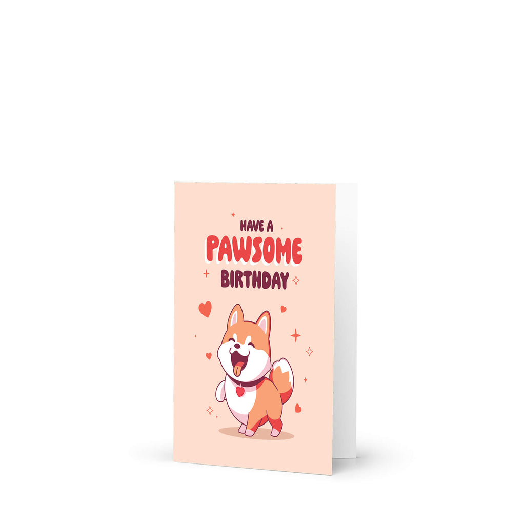 Greeting card with a cartoon dog and 'Have a Pawsome Birthday' text on a light pink background