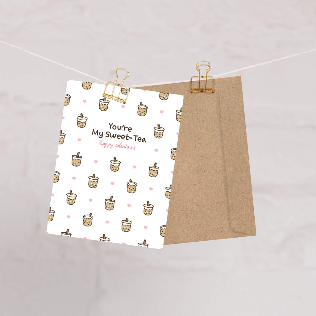 valentines day card with Pattern of small boba cups with hearts and the line “You’re My Sweet-Tea.”