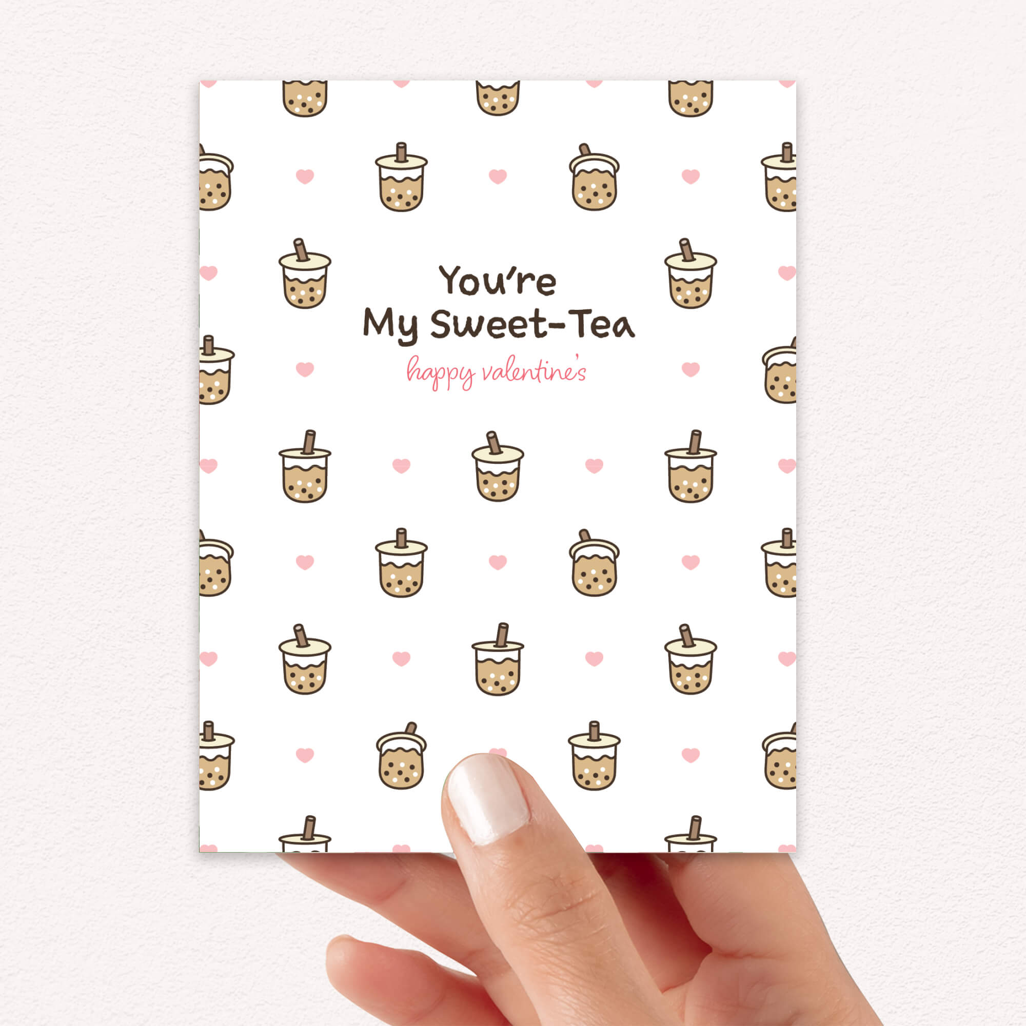 valentines day card with Pattern of small boba cups with hearts and the line “You’re My Sweet-Tea.”