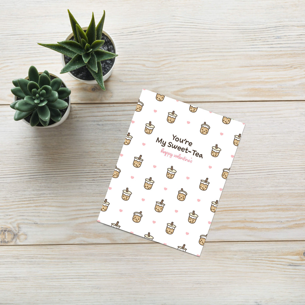 valentines day card with Pattern of small boba cups with hearts and the line “You’re My Sweet-Tea.”