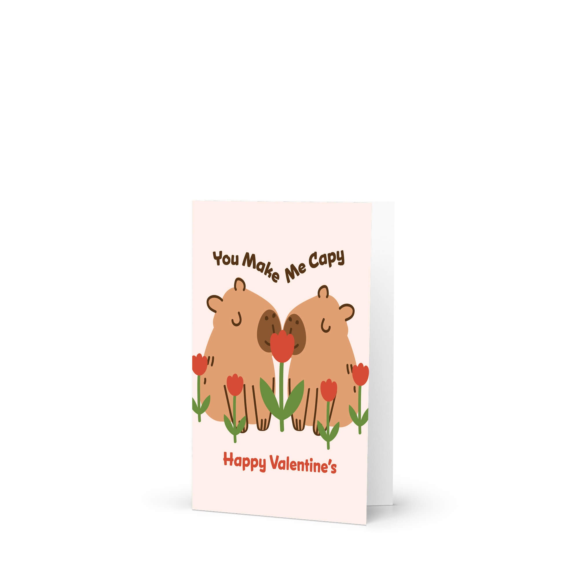 Two capybaras with tulips; curved text “You Make Me Capy” and “Happy Valentine’s.”