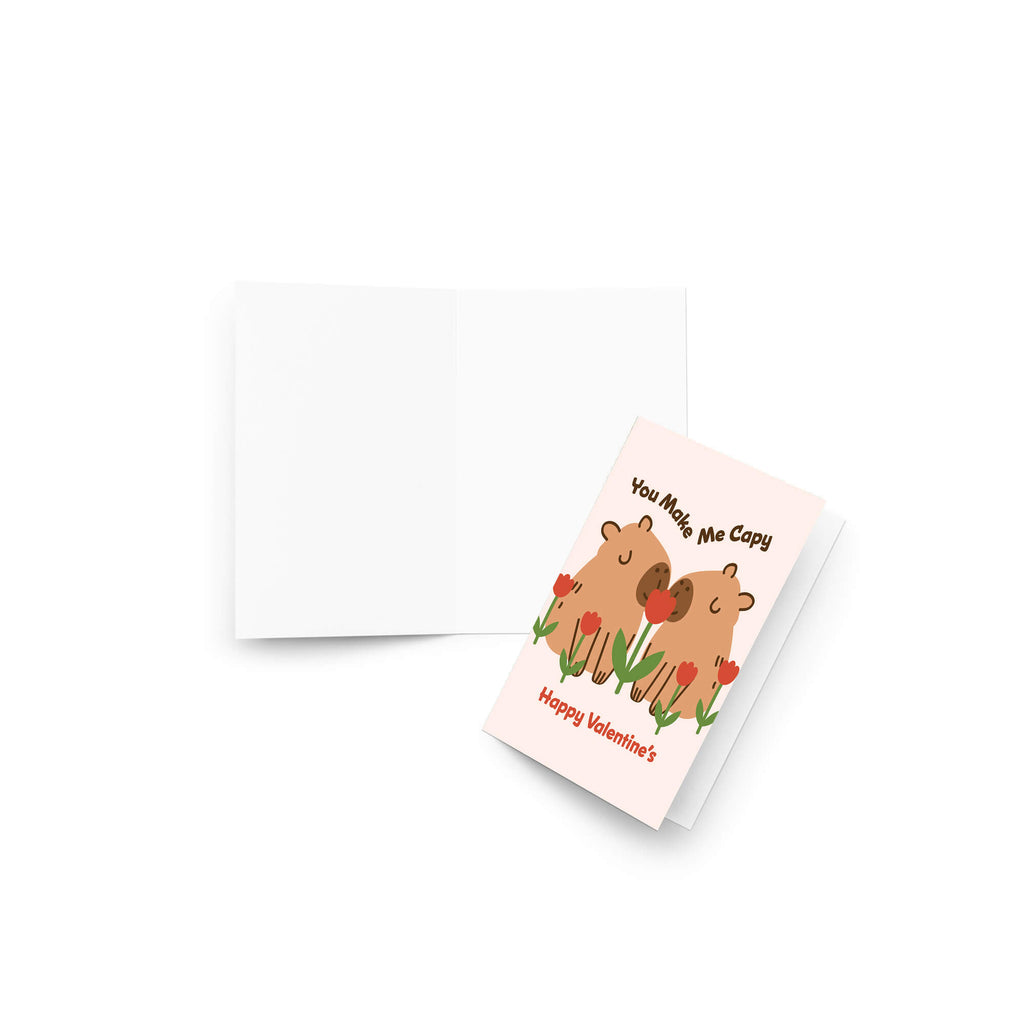 Two capybaras with tulips; curved text “You Make Me Capy” and “Happy Valentine’s.”