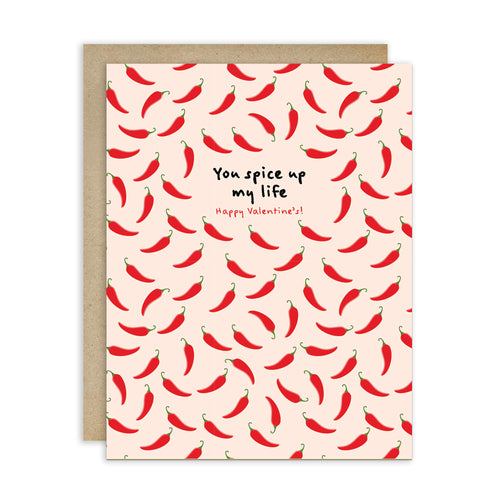 light pink valentines day card with repeating red chilies and center text “You spice up my life — Happy Valentine’s.”