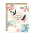 Two swallows flying near blossoms and pale sun with “Happy Valentine’s Day.”