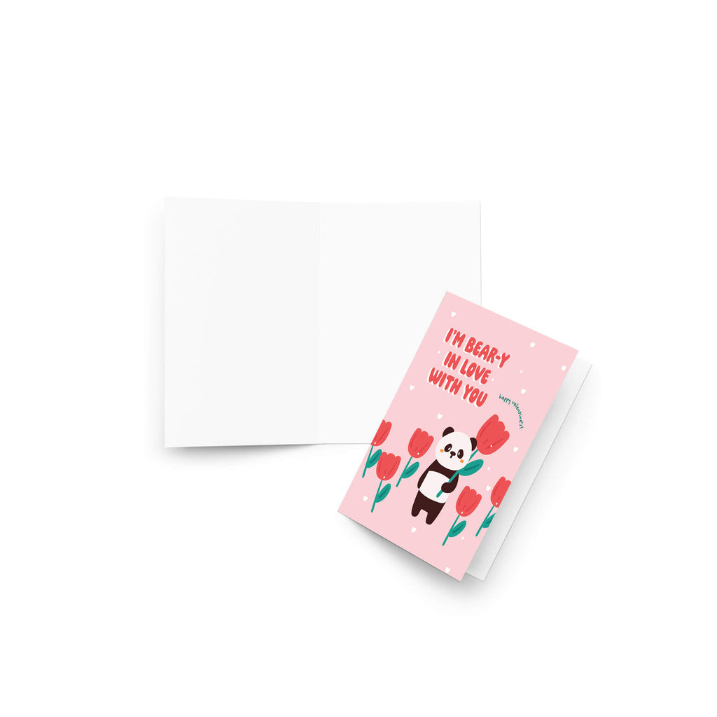 Panda holding tulip among pink flowers; text “I’m bear-y in love with you — happy valentine’s!”