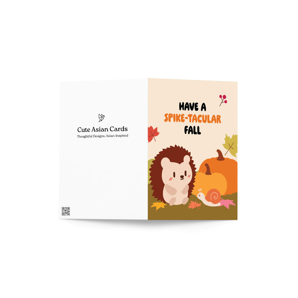 autumn greeting Card with a hedgehog, pumpkin, and text 'Have a Spike-tacular Fall' on a white background.