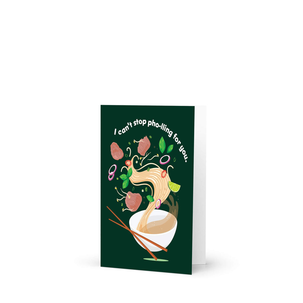 asian greeting card with a bowl of pho and chopsticks on a green background with text 'I can't stop pho-lling for you'.