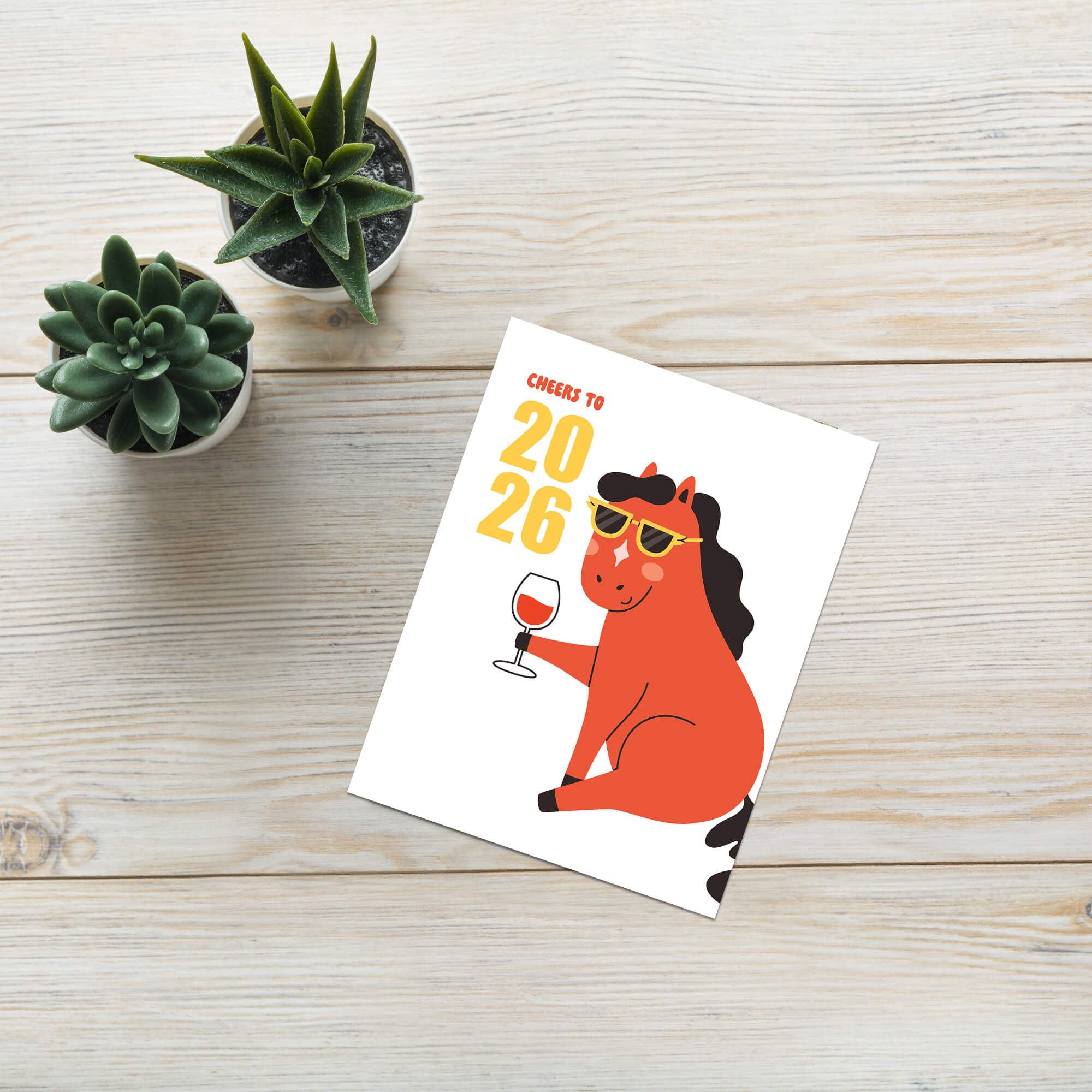 new year Card with a horse holding a glass of wine and text 'Cheers to 2026' on a white background.