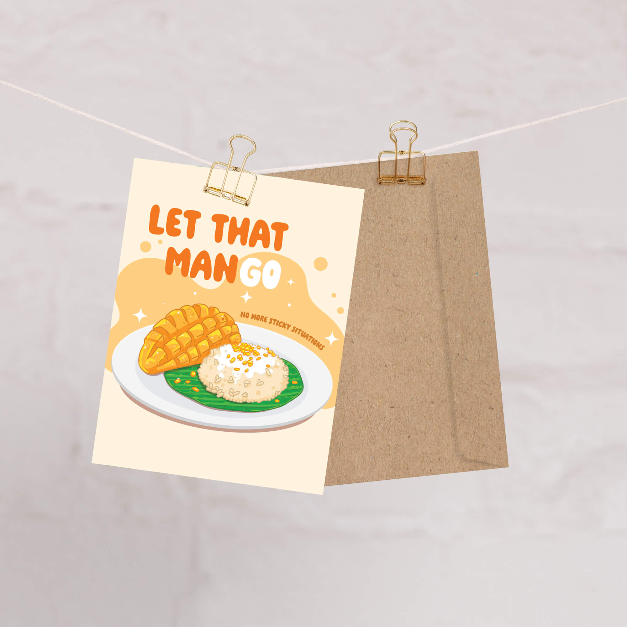 Notebook with a mango illustration and text 'Let That Mango' on a beige background
