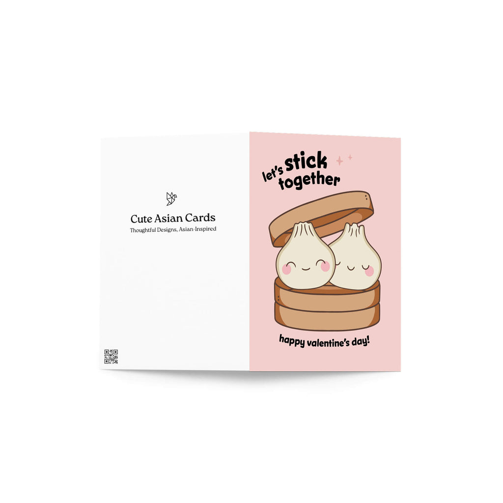 Two smiling soup dumplings in bamboo steamer; text “Let’s stick together — happy valentine’s day.”