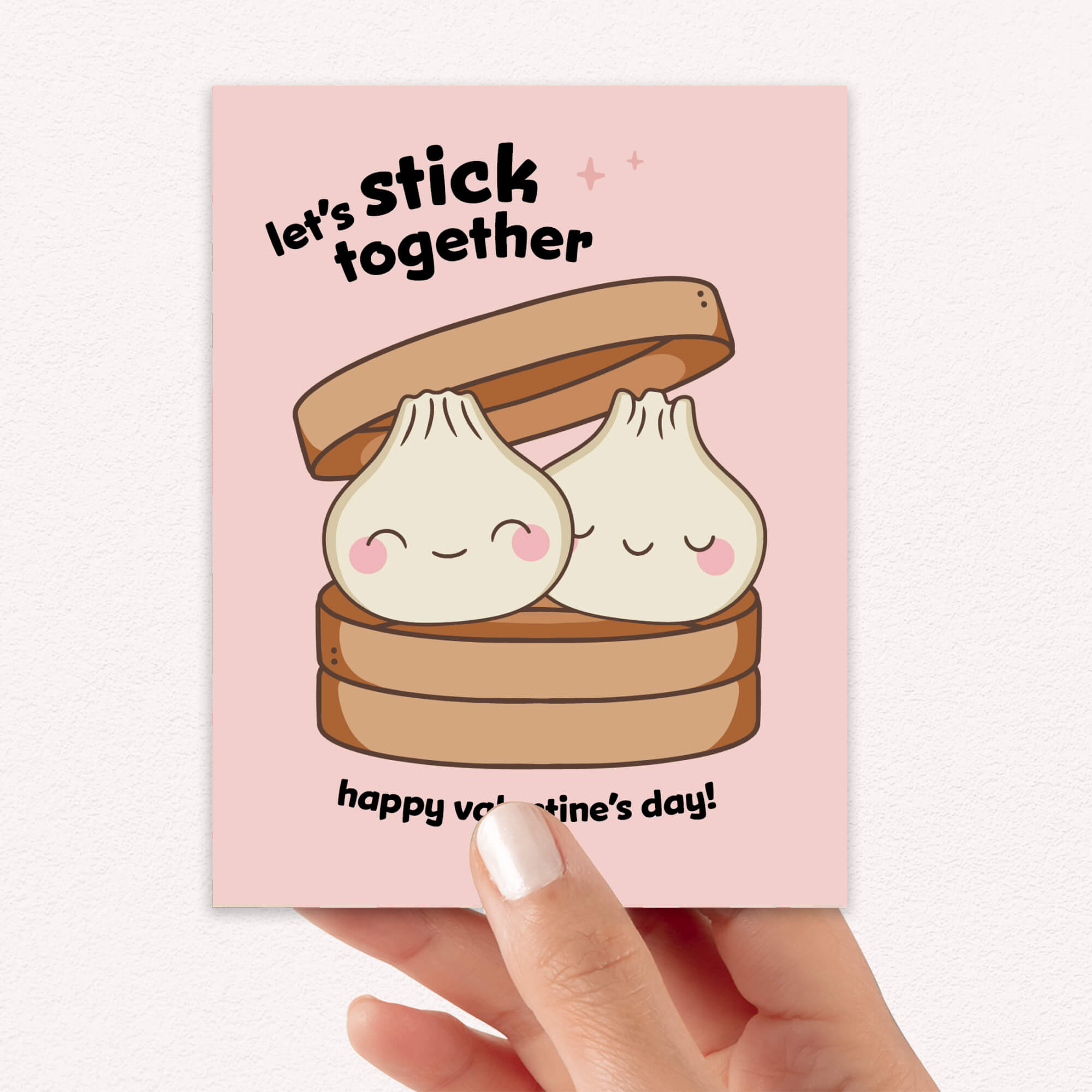 Two smiling soup dumplings in bamboo steamer; text “Let’s stick together — happy valentine’s day.”