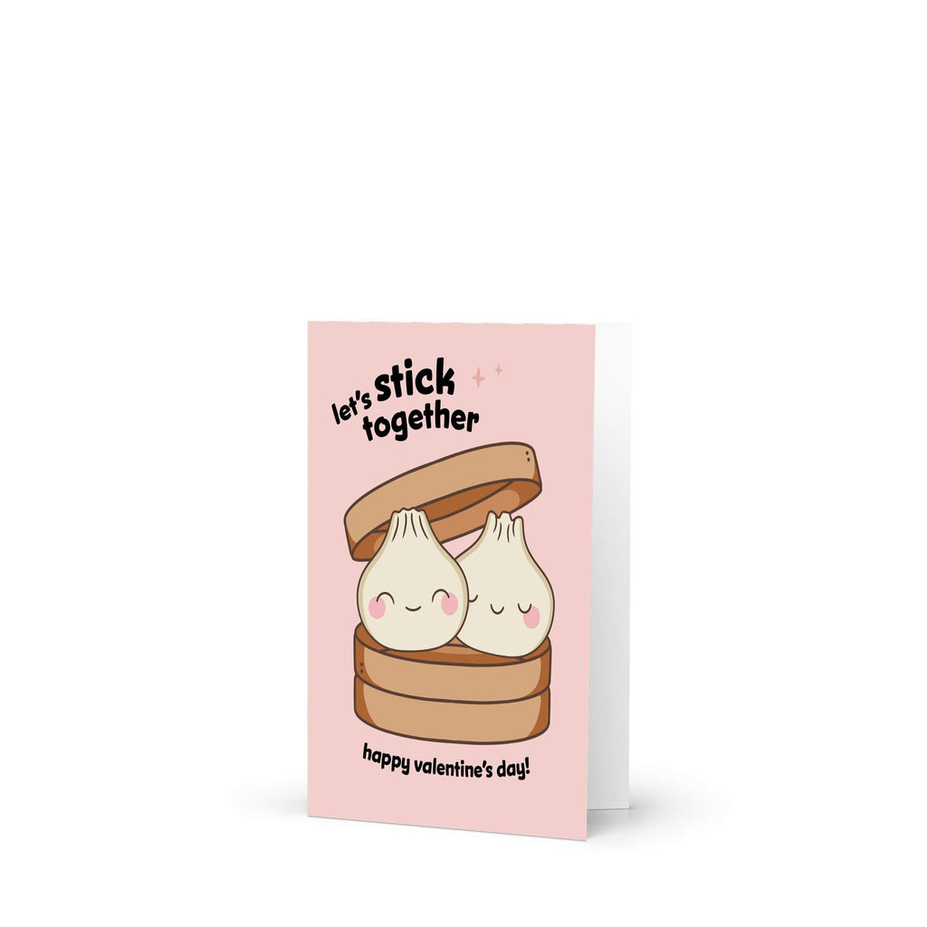 Two smiling soup dumplings in bamboo steamer; text “Let’s stick together — happy valentine’s day.”