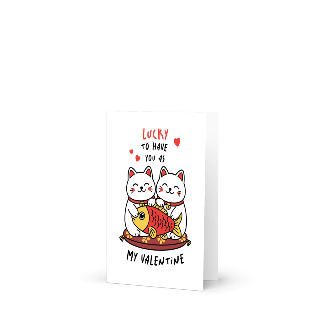Valentine's Day card with two lucky maneki neko cats and a fish illustration, text 'Lucky to have you as my Valentine'.