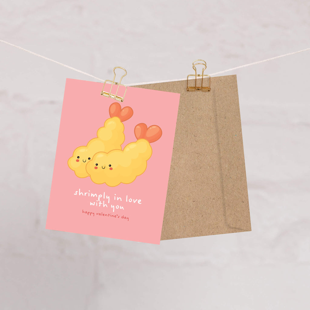 Valentine's Day card with Heart-shaped tempura shrimp on blush pink with “shrimply in love with you.”