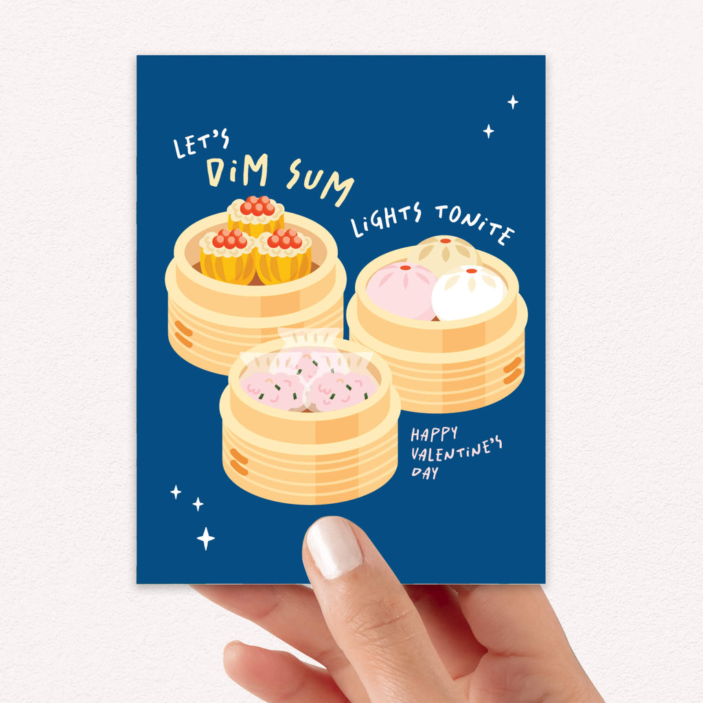 blue valentines day card with Three bamboo steamers on navy with text “Let’s dim sum lights tonite — Happy Valentine’s Day.”
