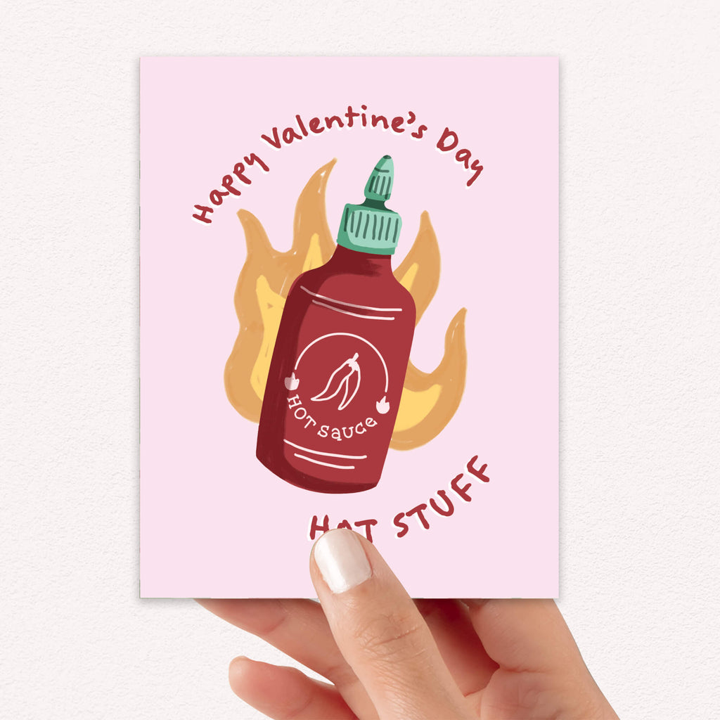 Red chili sauce bottle with flames; curved text “Happy Valentine’s Day — hot stuff.”
