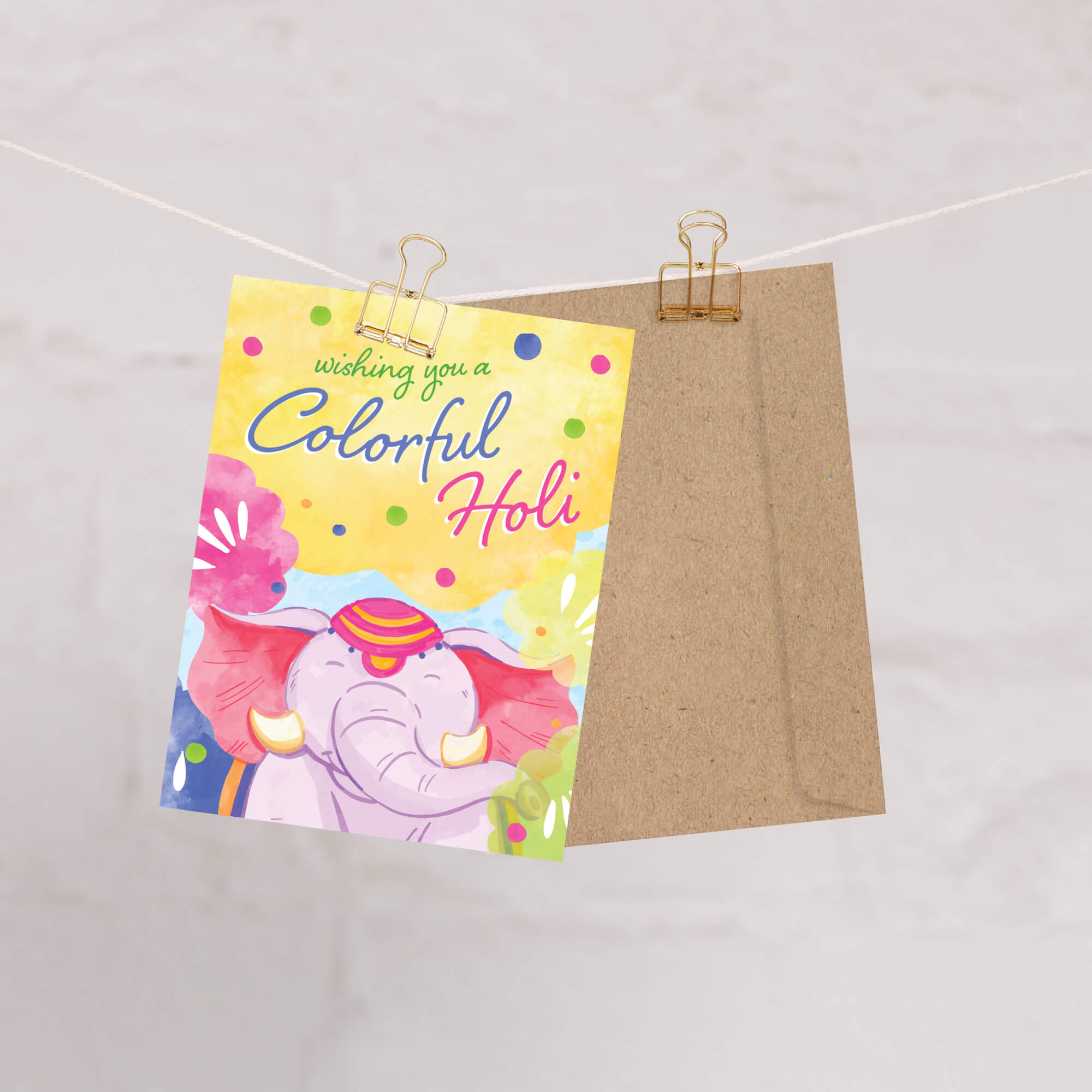 Colorful Holi card with an elephant design on a beige background