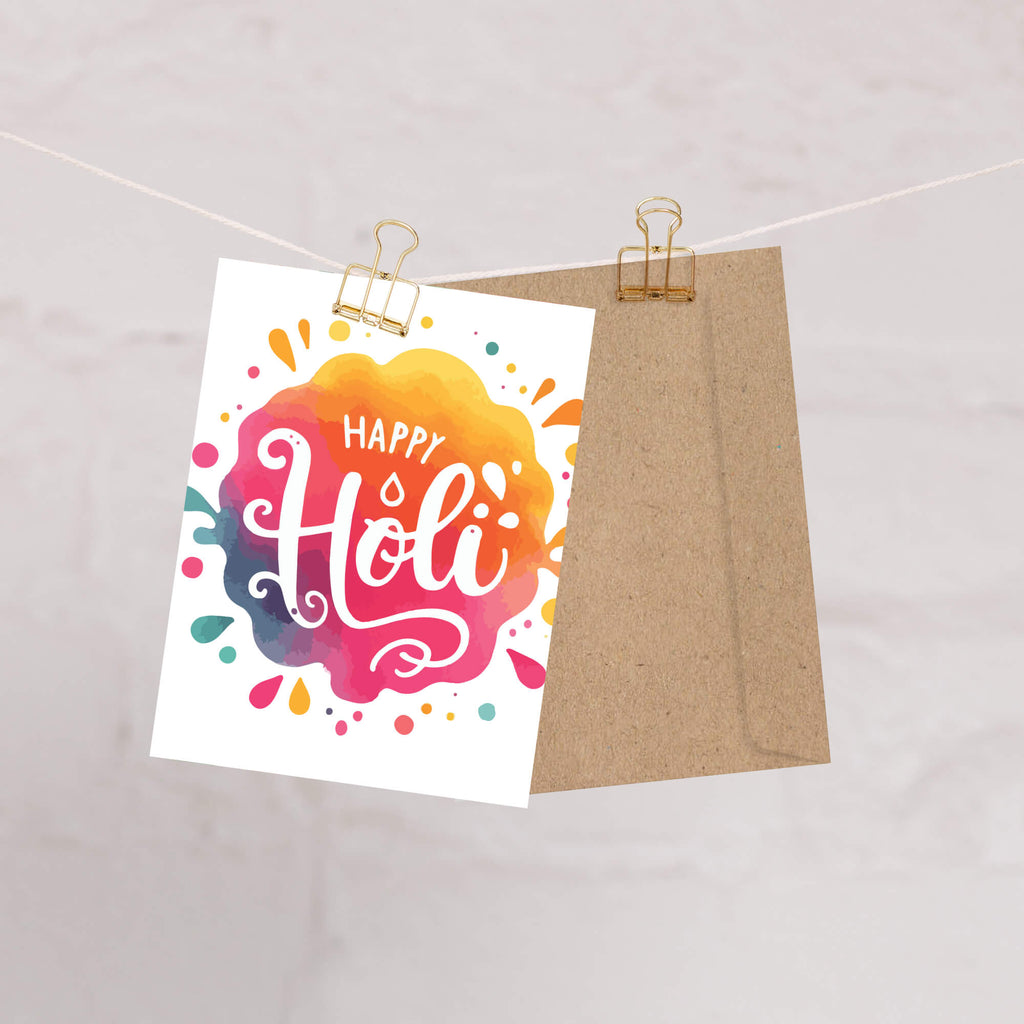 indian Greeting card with 'Happy Holi' text on a colorful watercolor background to celebrate hindu festival of color