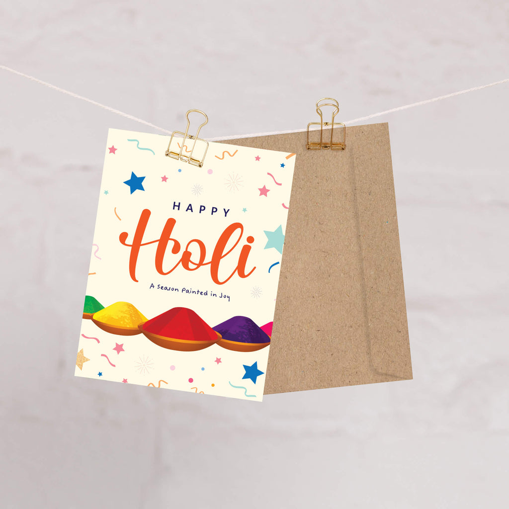 indian Greeting card with 'Happy Holi' text and colorful powder illustrations on a white background for hindu festival of color