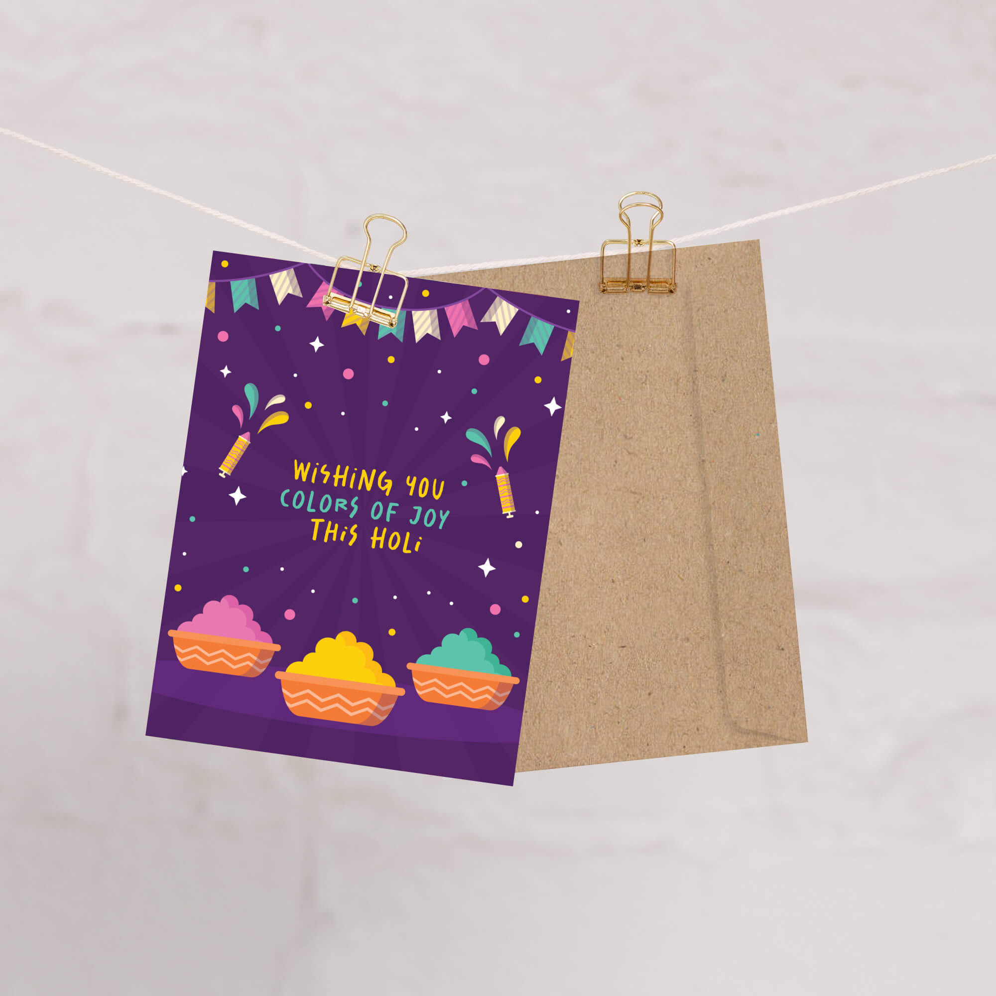 indian Greeting card with colorful design and text 'Wishing you colors of joy this Holi' on a purple background for hindu festival of colors