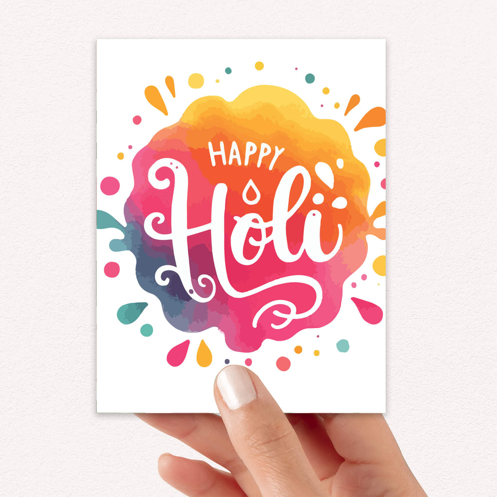 indian Greeting card with 'Happy Holi' text on a colorful watercolor background to celebrate hindu festival of color