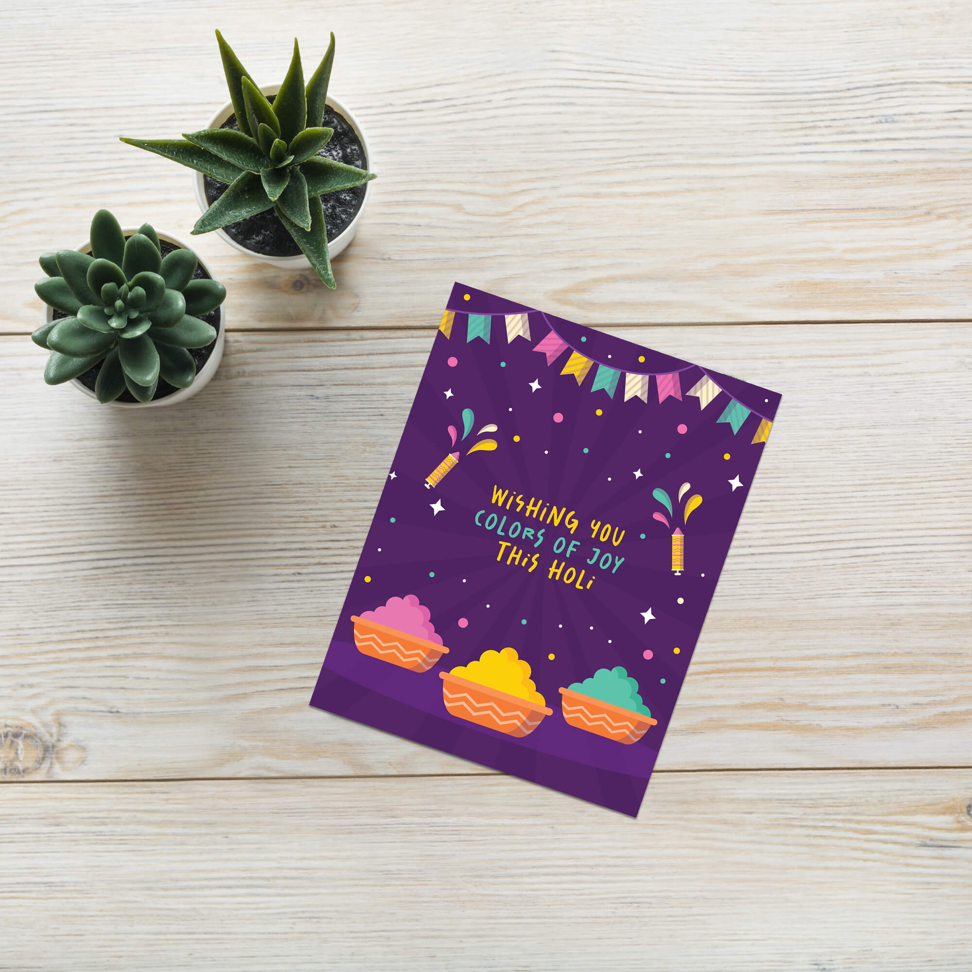 indian Greeting card with colorful design and text 'Wishing you colors of joy this Holi' on a purple background for hindu festival of colors
