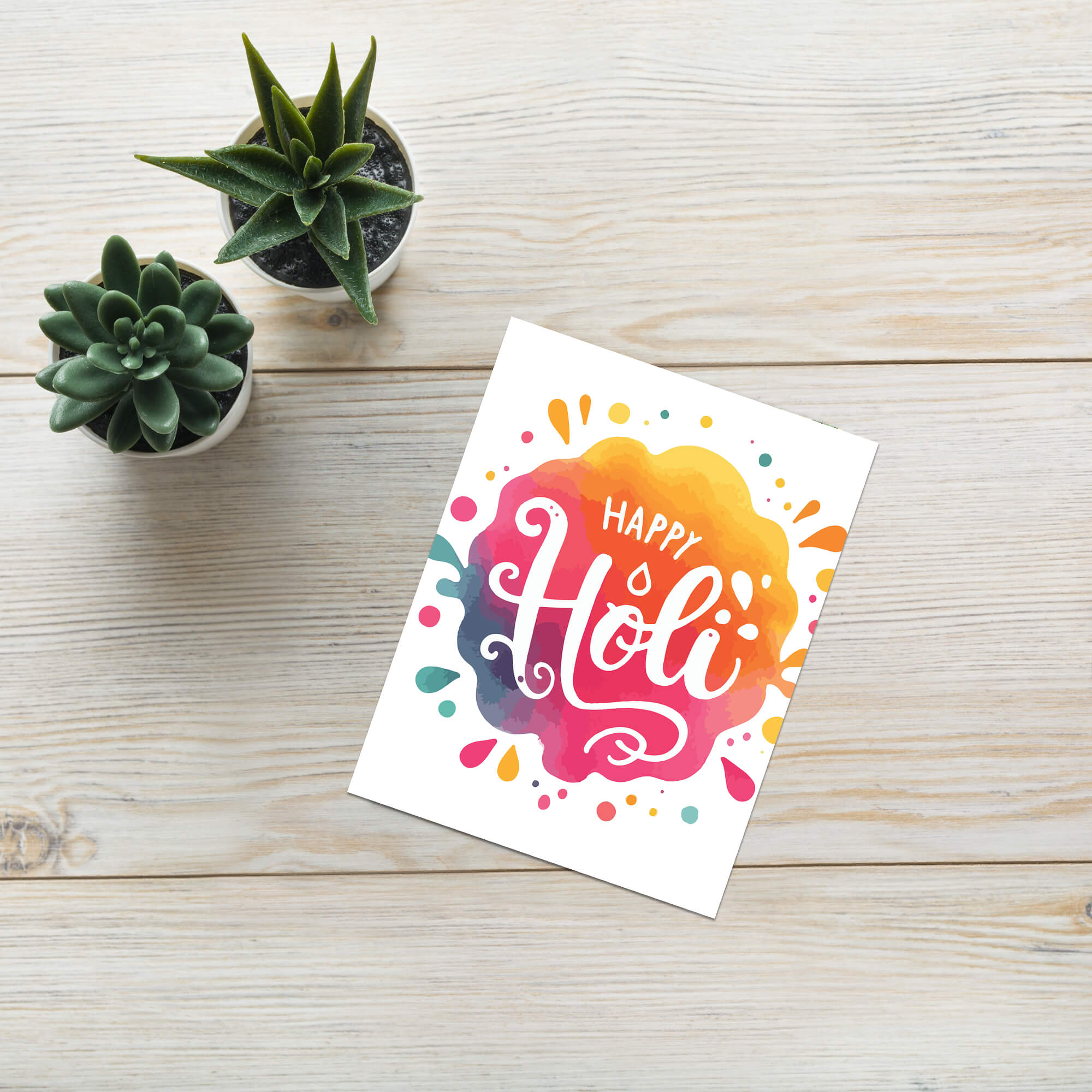 indian Greeting card with 'Happy Holi' text on a colorful watercolor background to celebrate hindu festival of color