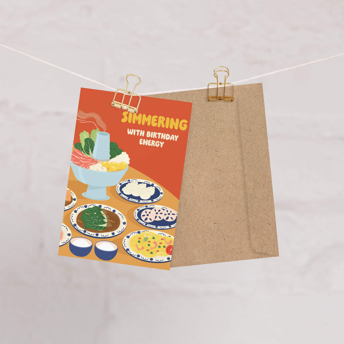 hot-pot-asian-greeting-cards-cute-birthday-happy-shabu-thai-chinese-rice-simmering Greeting card with food illustrations and text 'Simmering with Birthday Energy' on a beige background.