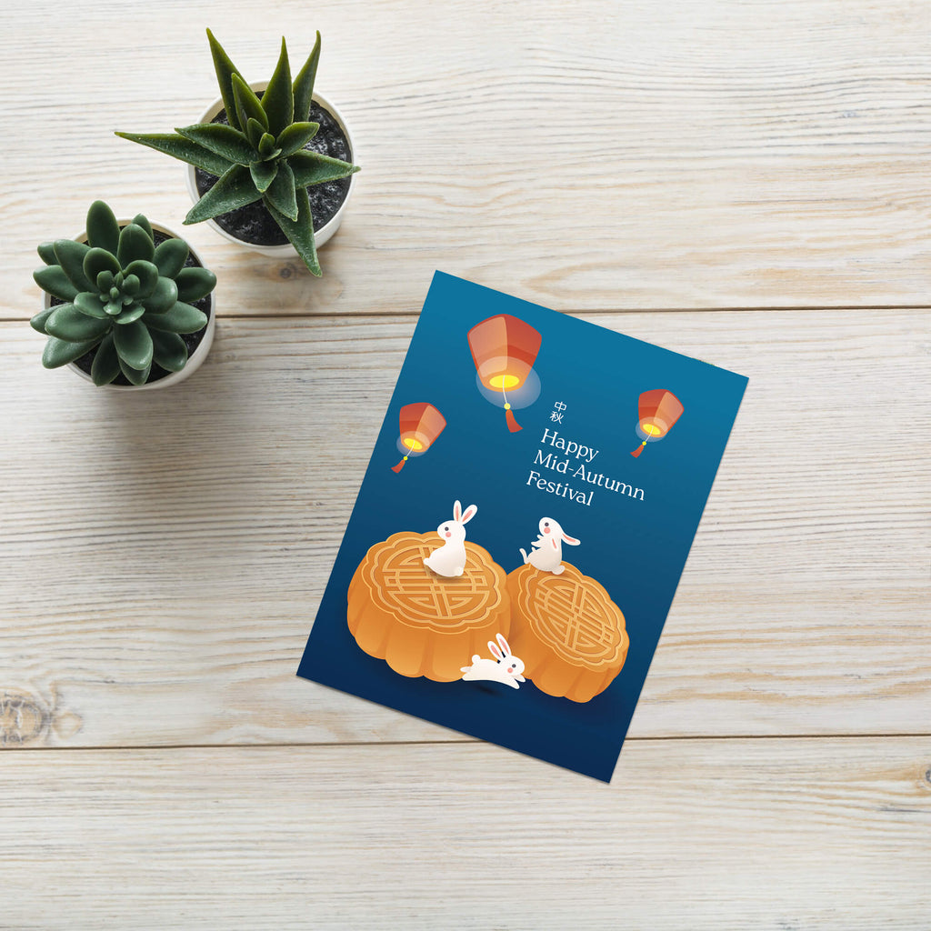 chinese inspired Greeting card with mooncakes and lanterns for Mid-Autumn Festival on a wooden surface with plants.