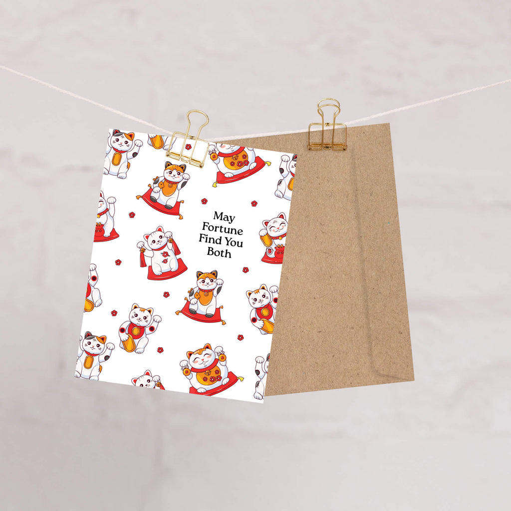 asian wedding Greeting card with maneki-neko cats and text 'May Fortune Find You Both' on a white background.