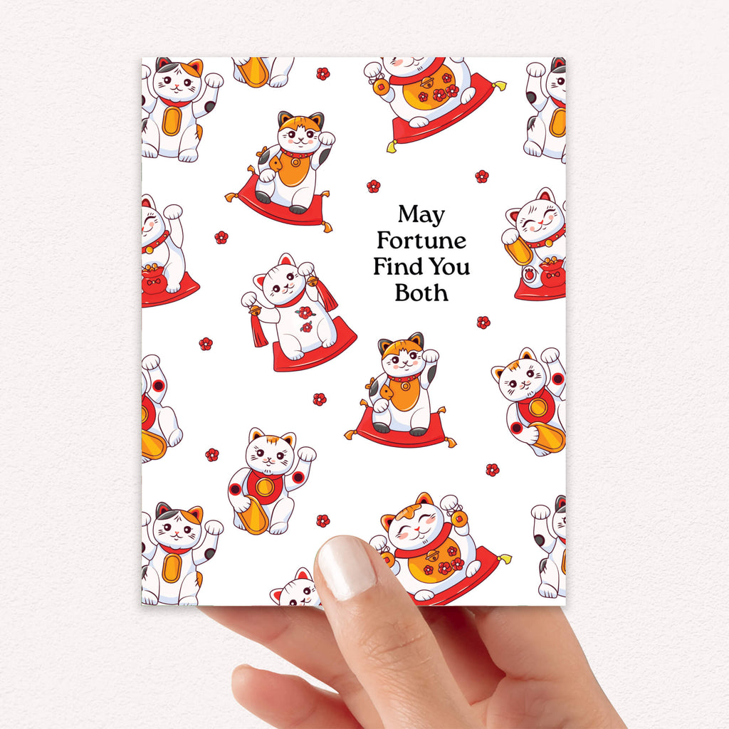 asian wedding Greeting card with maneki-neko cats and text 'May Fortune Find You Both' on a white background.