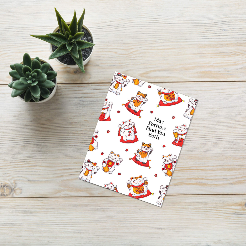 asian wedding Greeting card with maneki-neko cats and text 'May Fortune Find You Both' on a white background.
