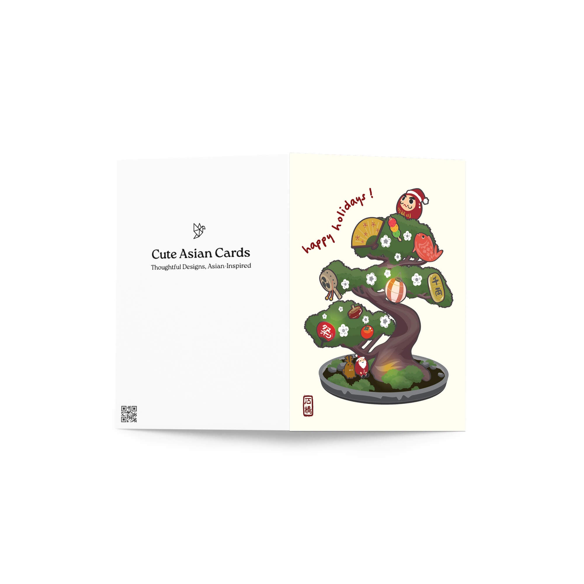 cute japanese christmas card with an Illustration of a bonsai tree decorated with lucky charms, daruma, and red lanterns. Text reads “happy holidays!”